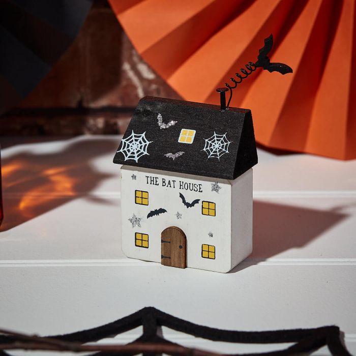 White Halloween Bat House ornament by Shabbyquins, featuring a spooky bat design suitable for Halloween decor.