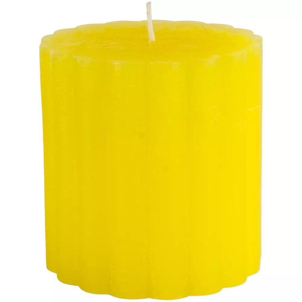 Rustic scalloped lemon pillar candle by Sable Homeware, showcasing a warm yellow candle with a textured, scalloped edge design.