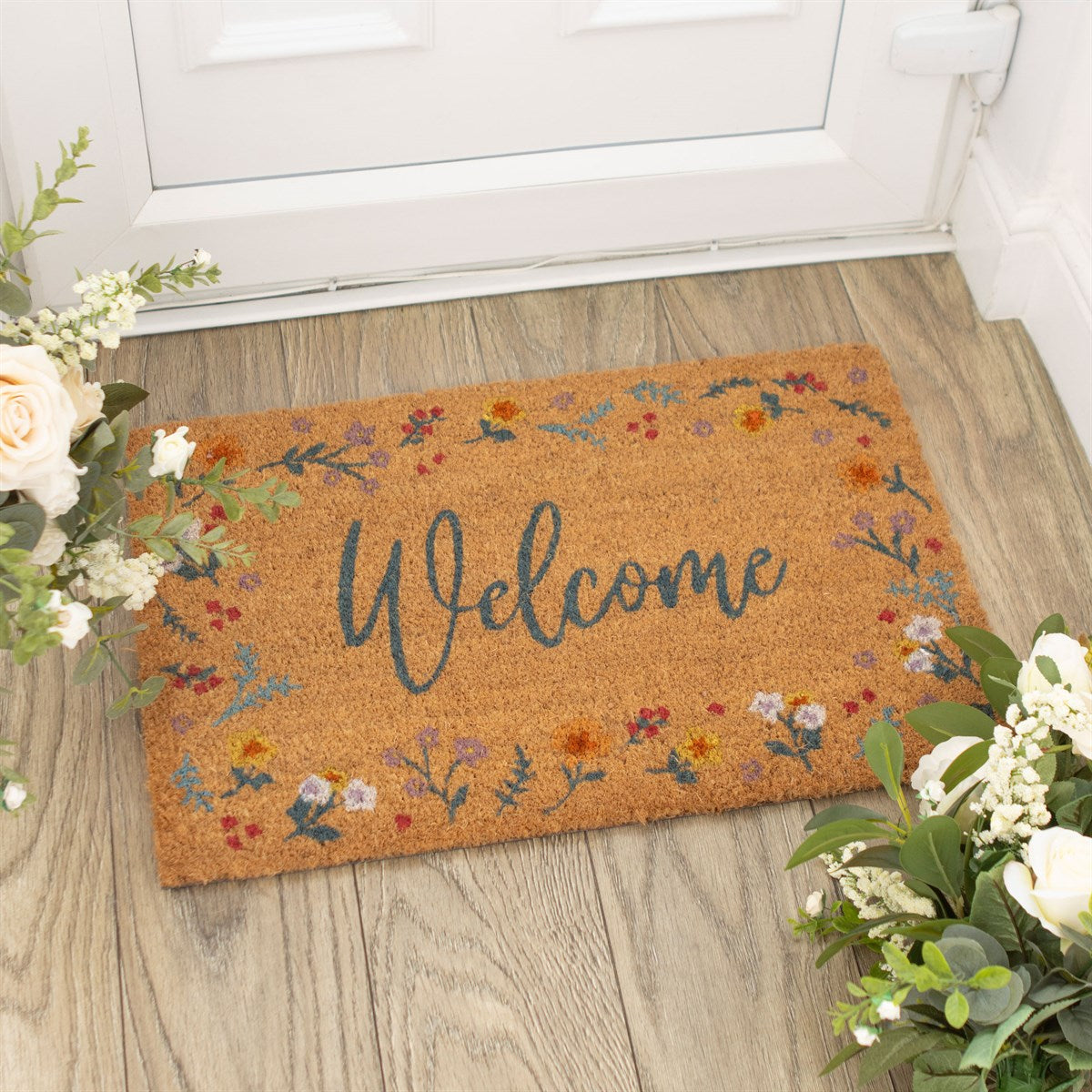 Sable Homeware door mat with a woven design, placed at an entrance, showcasing its decorative and functional style.