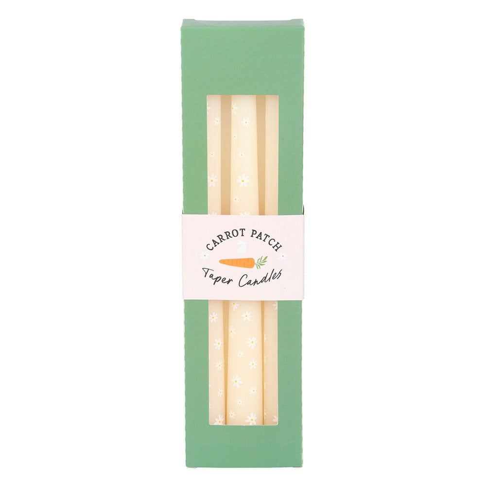 Set of three Carrot Patch Daisy Print taper candles by Sable Homeware with colorful floral designs on tall candle sticks.