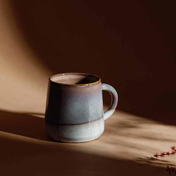 Sable Homeware Mojave Glaze Mug in various colors, showcasing a stylish ceramic mug on a lifestyle setting.