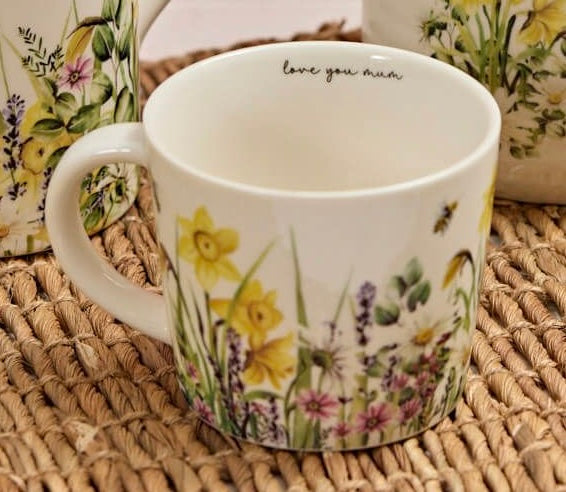 Sable Homeware ceramic vase and mug set featuring floral and bee designs, showcasing vibrant flowers and a bee motif.