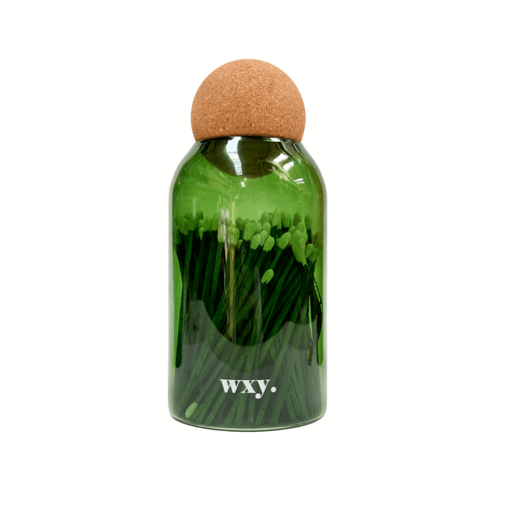 Green luxury matches in a cork stopper jar by Sable Homeware, showcasing elegant packaging and natural wooden matches inside.