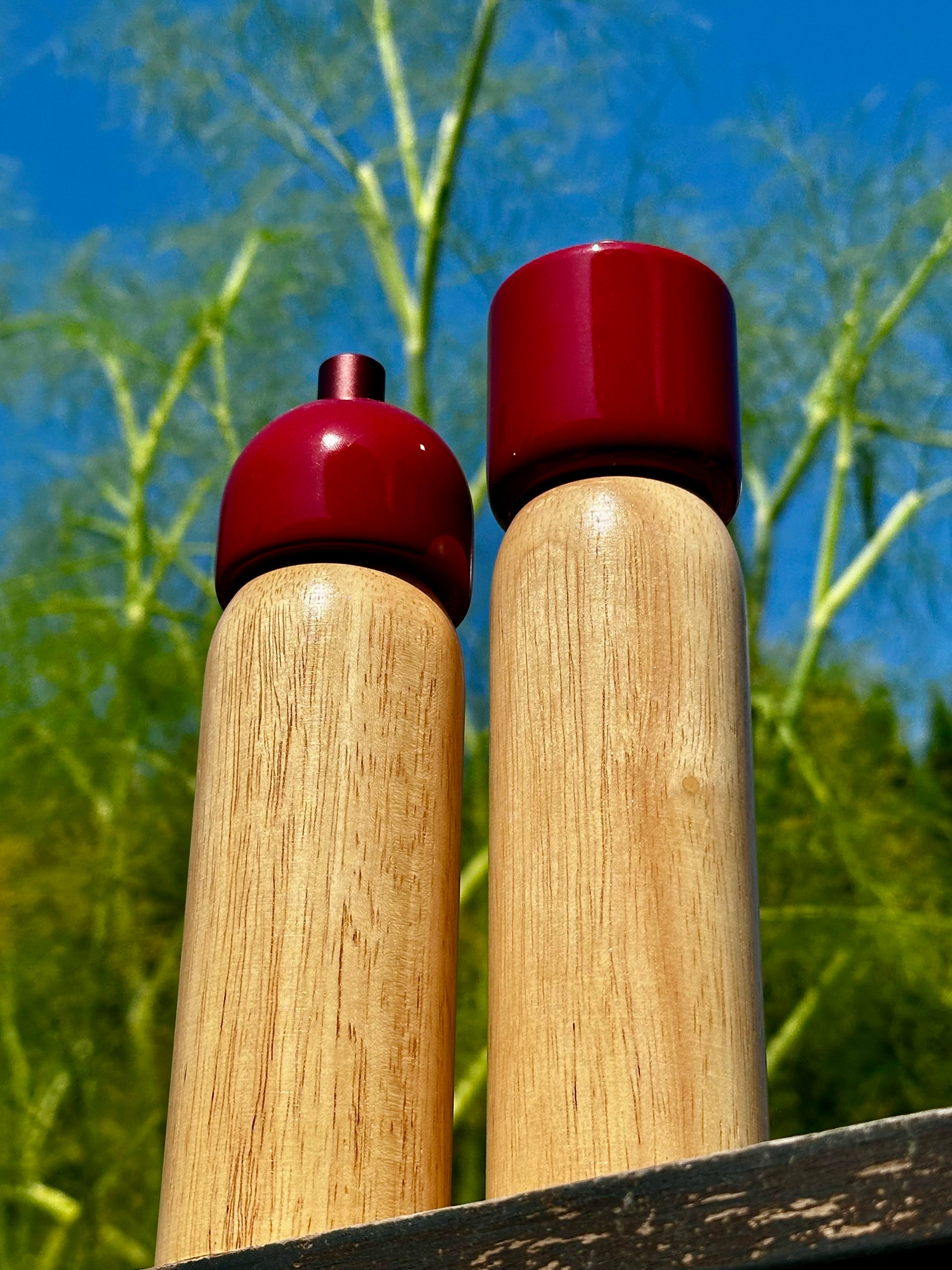 Red Sable Homeware Deluxe Salt and Pepper Grinder set on a table, showcasing stylish kitchen accessories for seasoning.
