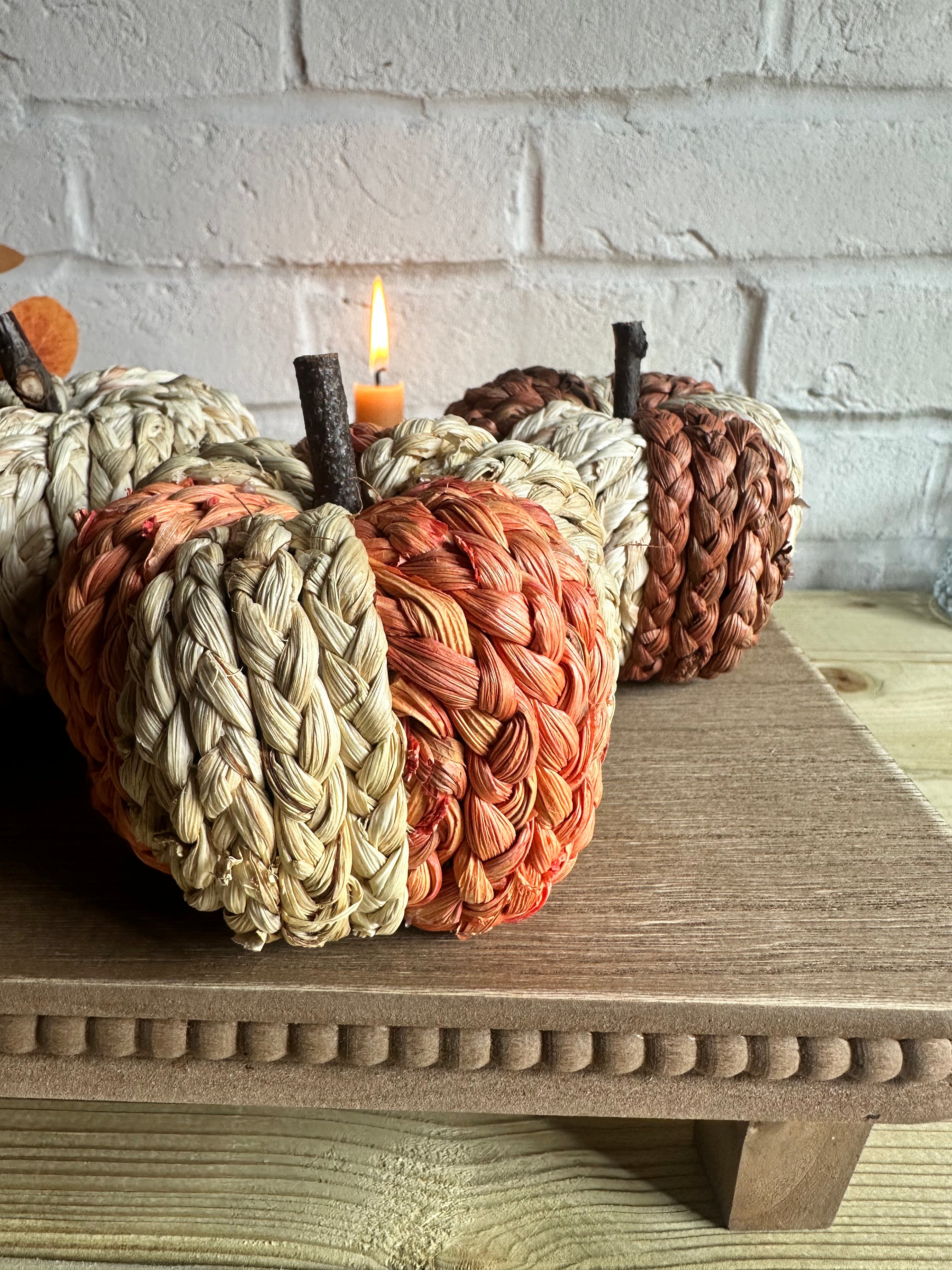 Set of 3 small raffia Halloween pumpkins in two color options, featuring textured raffia surfaces for festive autumn decor.