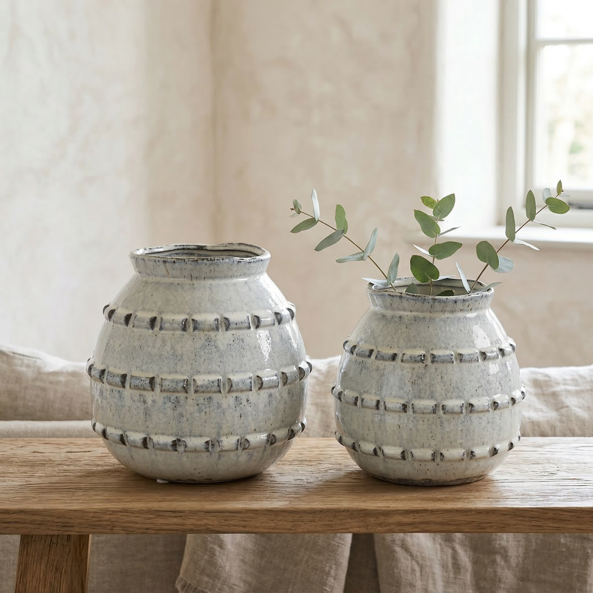 Soft grey tactile vase by Sable Homeware, shown in two sizes, with a smooth, textured surface perfect for modern home decor.