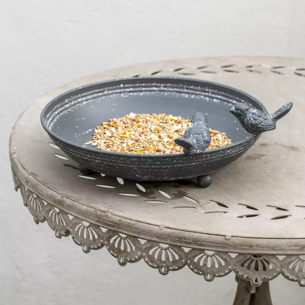 Grey metal bird bath and feeder with decorative feet, ideal for outdoor birdwatching and garden decoration by Sable Homeware.