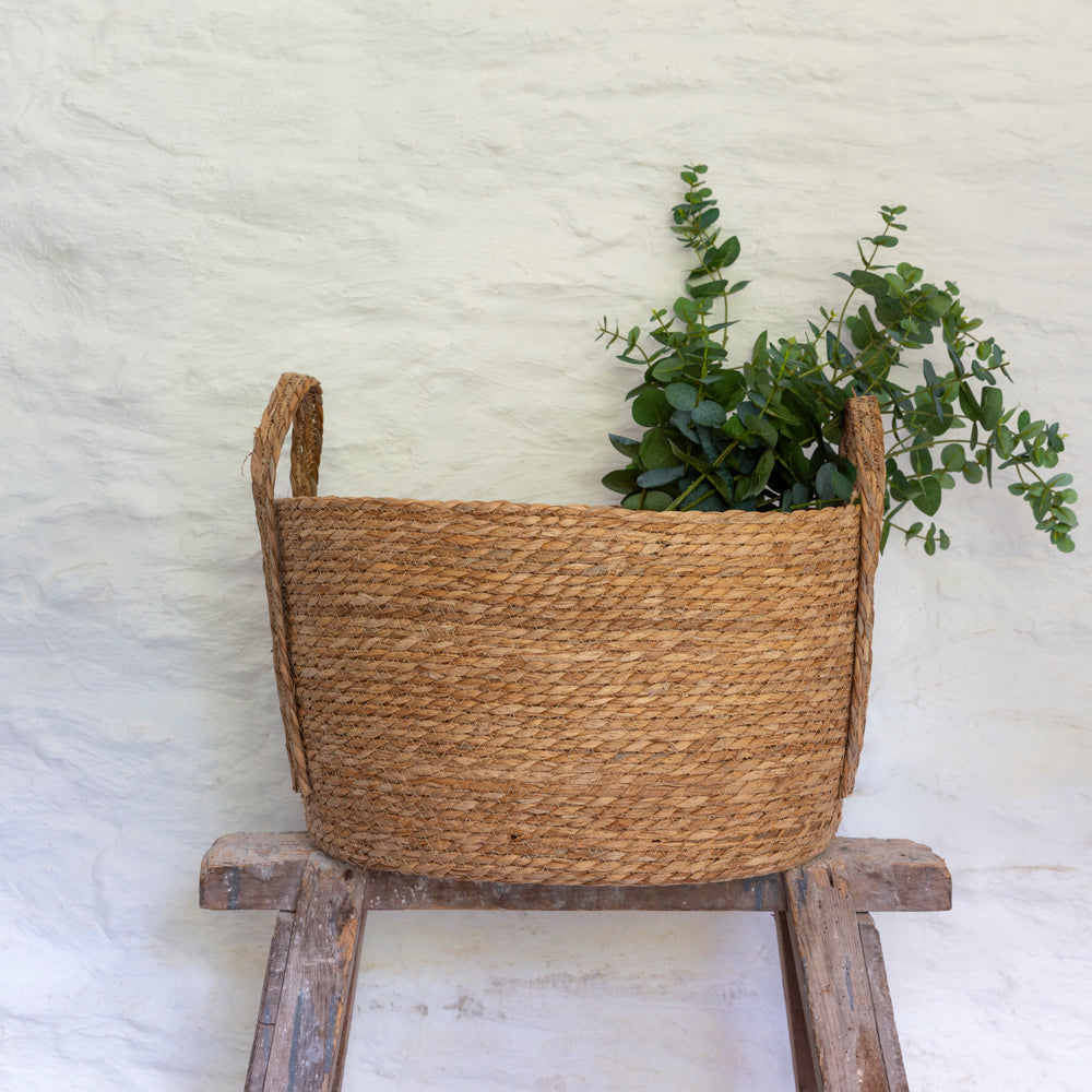 Set of three oval seagrass baskets with handles by Shabbyquins, natural woven baskets for storage and decor.