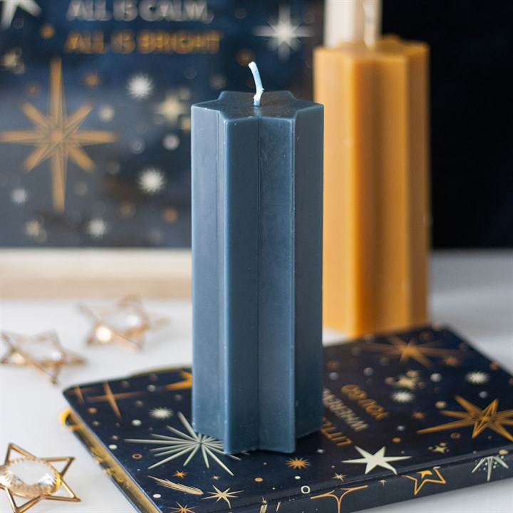 Star-shaped taper candle from Sable Homeware in three colors, featuring a star design and classic candle shape.