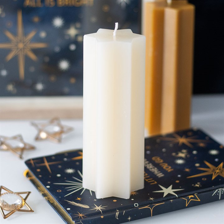 Star-shaped taper candle by Sable Homeware in three colors, featuring a stylish star design perfect for decorative lighting.