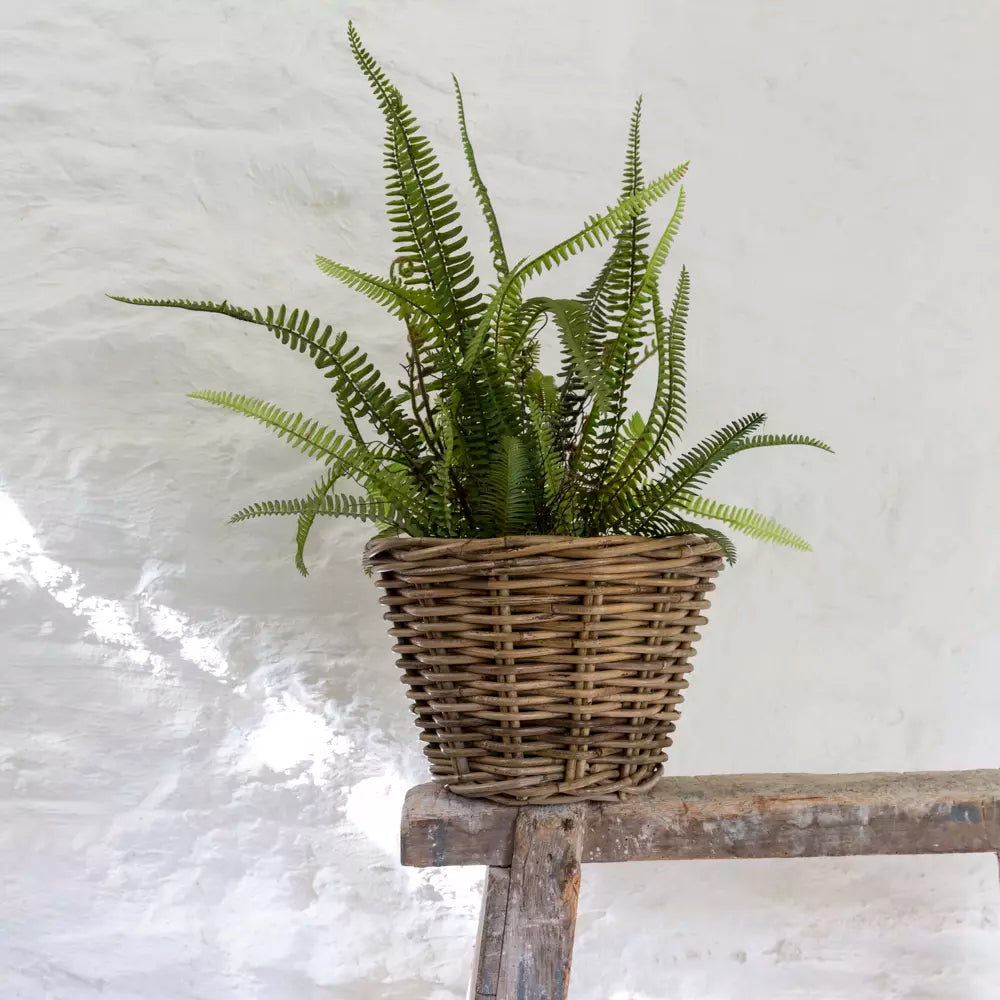 Grey and buff rattan round wicker small planter vase with woven texture, ideal for indoor plant display