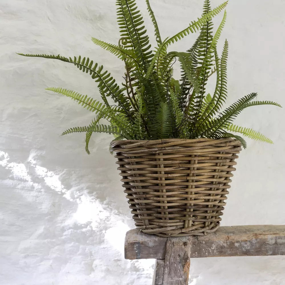 Small round planter by Sable Homeware in grey and buff rattan with a wicker design, perfect for indoor or outdoor plants.