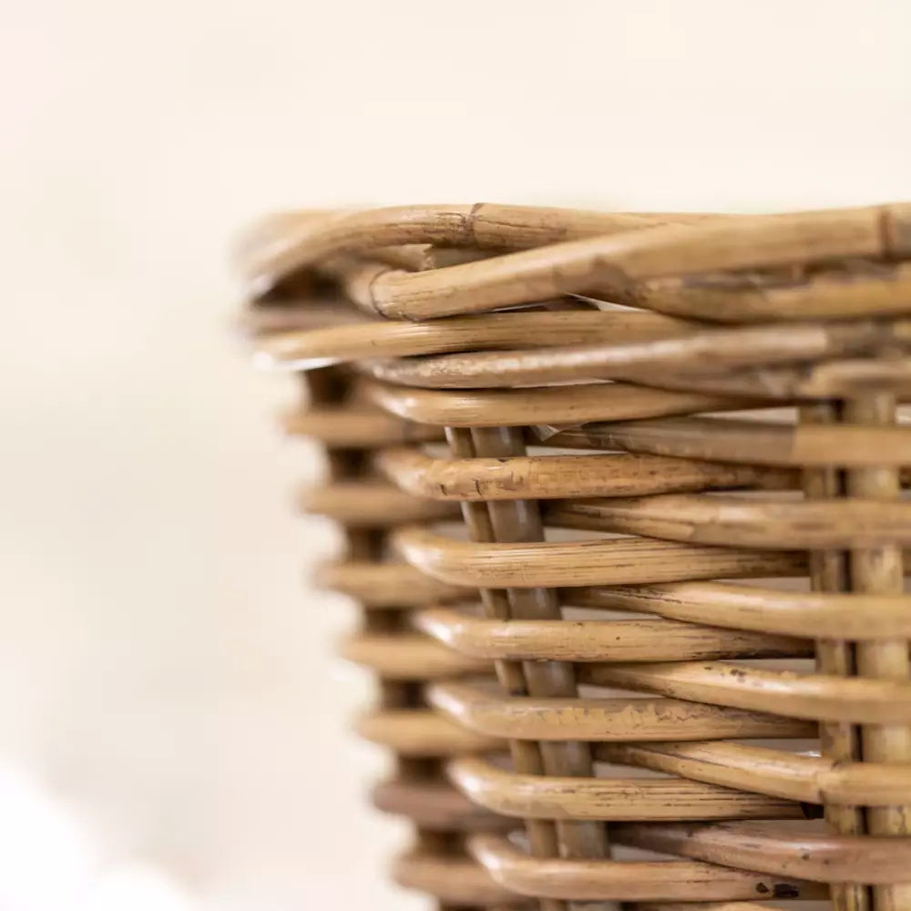 Gray and buff rattan round wicker vase with a small planter design, perfect for home decor or plant display.