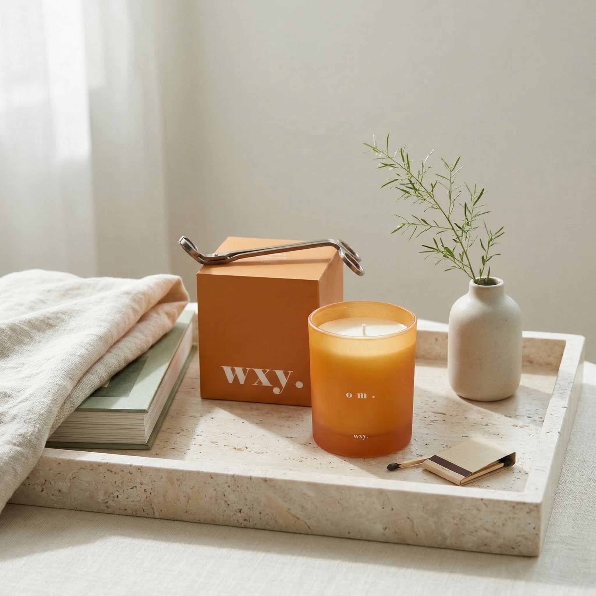 Sable Homeware Om bamboo leaf and neroli scented candle in a sleek candle holder for a serene, calming ambiance.