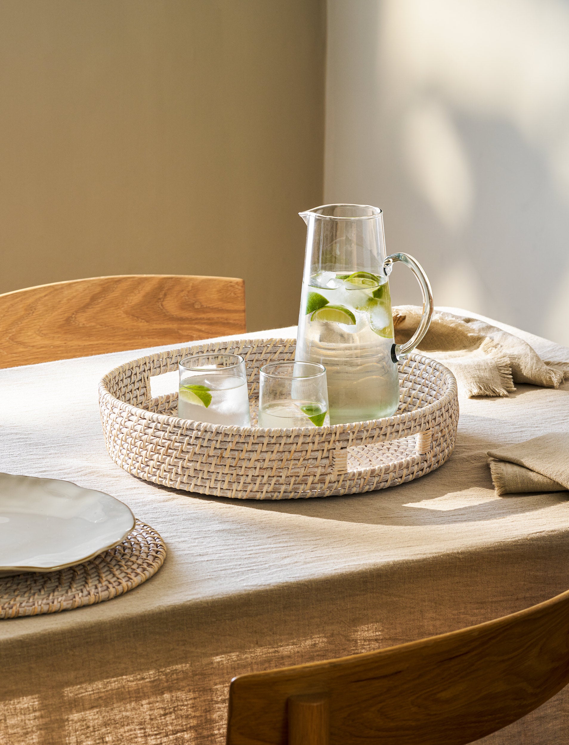 White Wittering round rattan serving board by Sable Homeware, featuring a stylish woven rattan design for serving or decor.