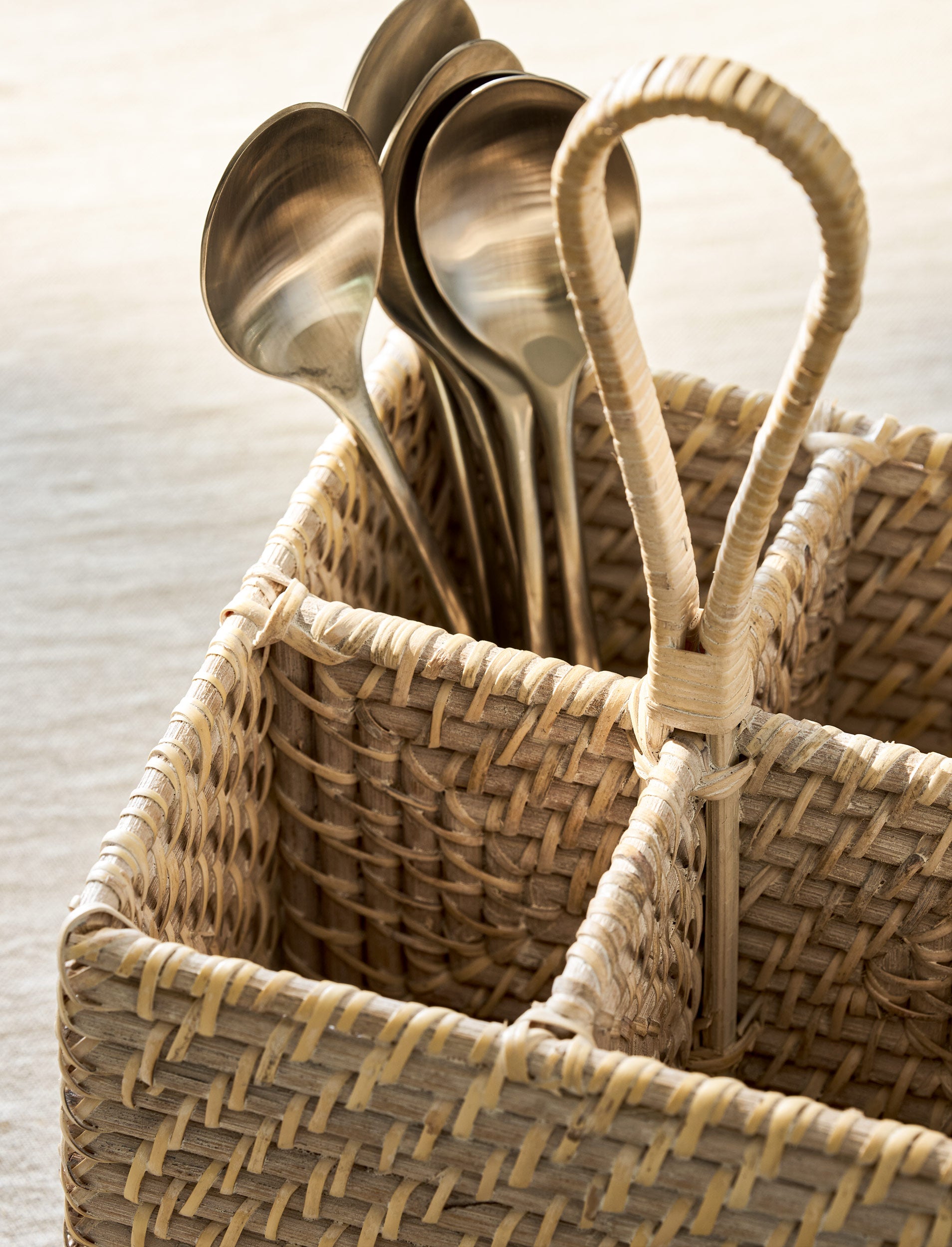 White rattan Wittering Cutlery Caddy by Sable Homeware for organizing kitchen utensils and cutlery.