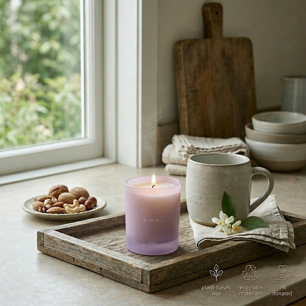 Sable Homeware Eos Orris Root & Amber scented candle with a white wax finish and elegant glass holder, perfect for relaxing ambiance.