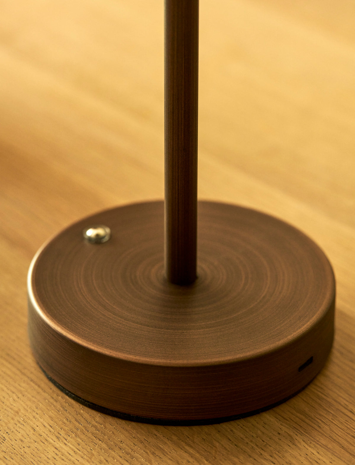 Cordless Burleigh table lamp, natural rattan and antique bronze