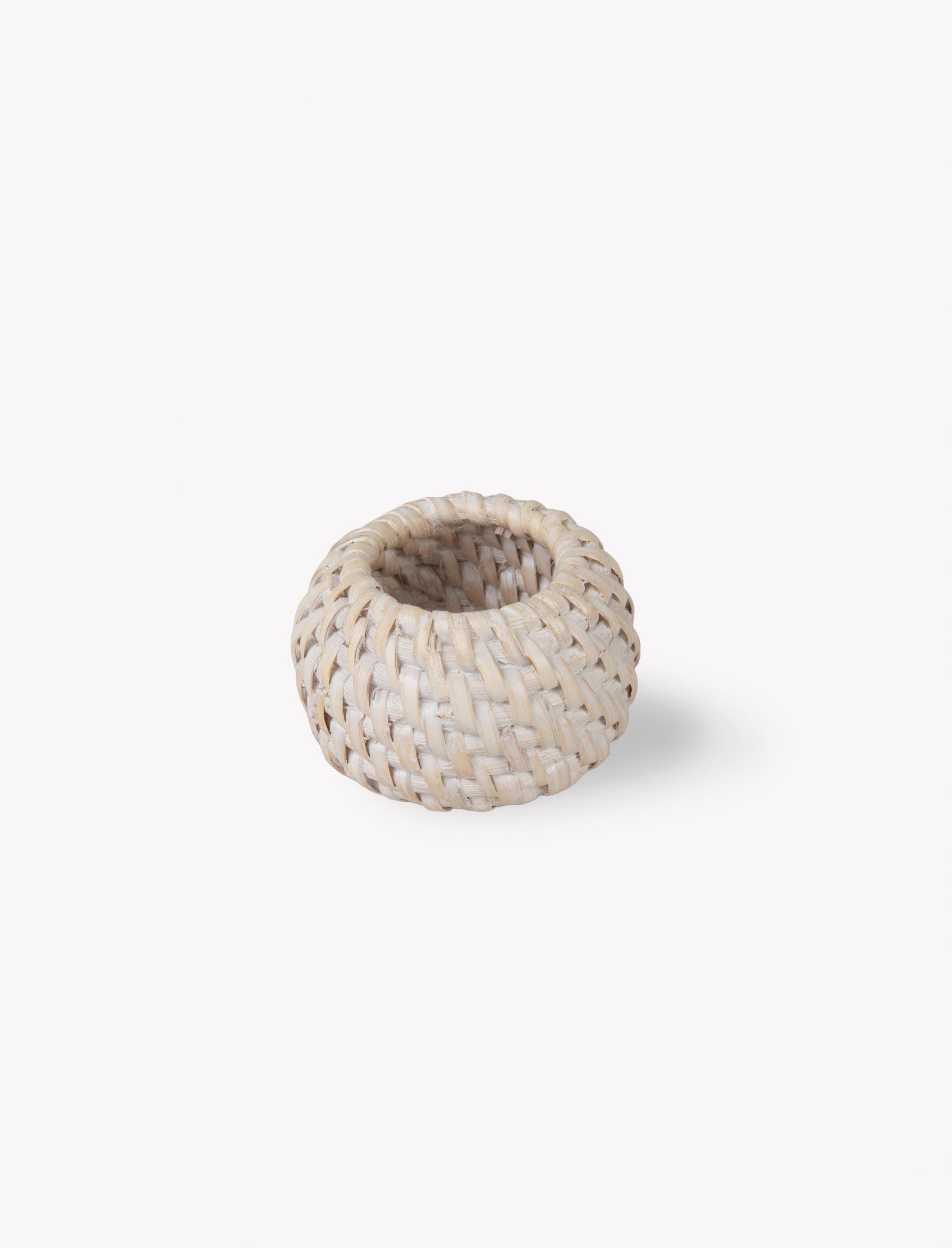 Set of four Wittering rattan white napkin rings from Sable Homeware, stylish table accessories for elegant dining setups.
