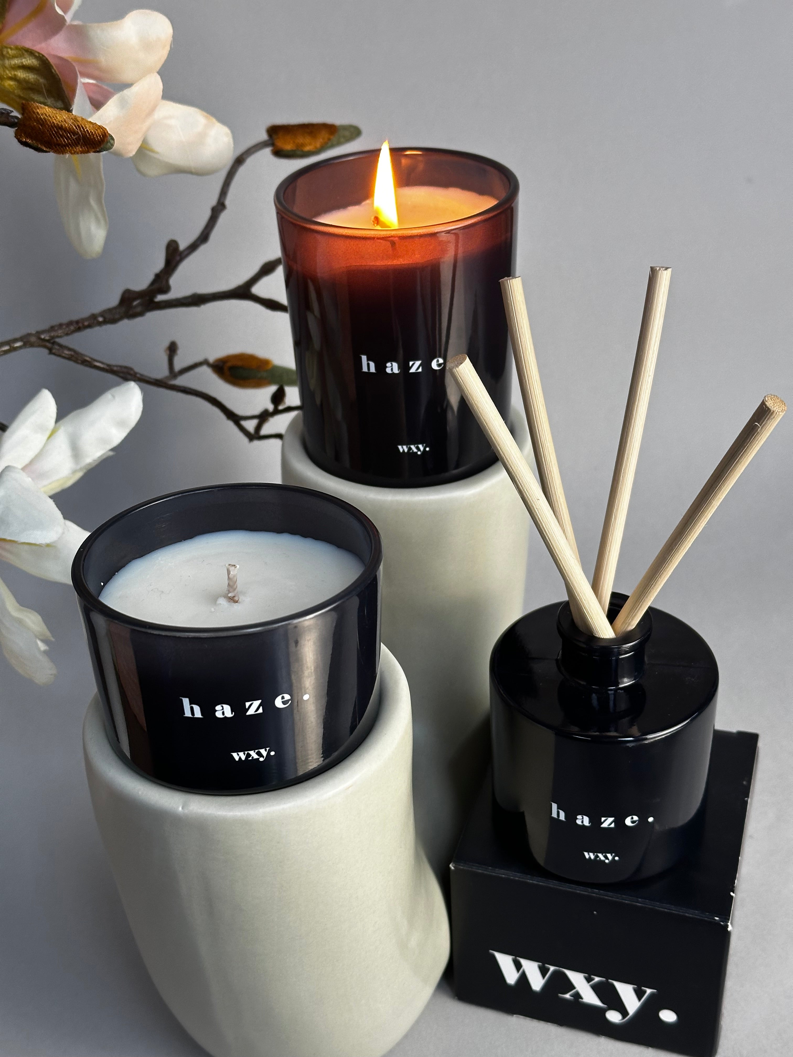 Haze Patchouli & Hemp scented candle by Sable Homeware with a sleek glass jar and flickering flame.