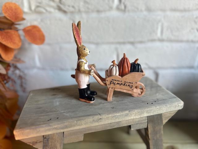 Shabbyquins Halloween rabbit ornament with pumpkin-filled wheelbarrow, featuring festive autumn decorations and detailed craftsmanship.