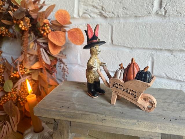 Shabbyquins Halloween ornament featuring a rabbit with a wheelbarrow, surrounded by pumpkins and autumn decorations.
