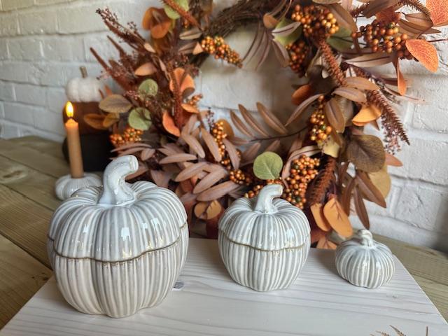 Set of two natural glazed ceramic pumpkin pots for Halloween decor by Sable Homeware, featuring textured orange and green pumpkin designs.