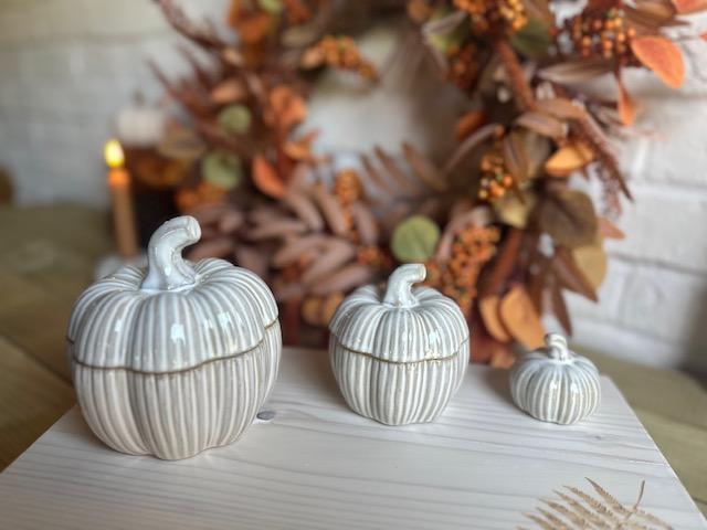 Set of two Shabbyquins natural glazed ceramic pumpkin pots for Halloween decorations, featuring orange pumpkin designs.