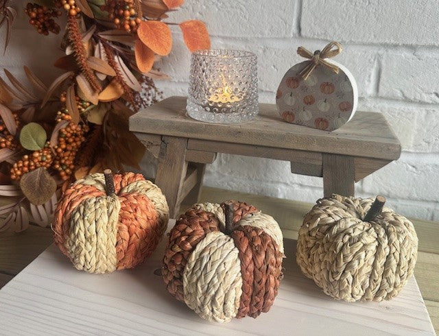 Set of 3 small raffia Halloween pumpkins in natural rattan, from Sable Homeware, with two color options for seasonal decor.