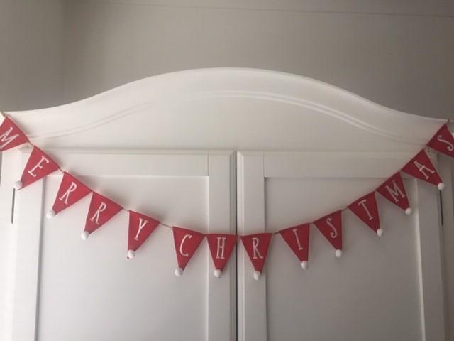 Red Merry Christmas bunting garland by Shabbyquins with festive flag banners for holiday decor.