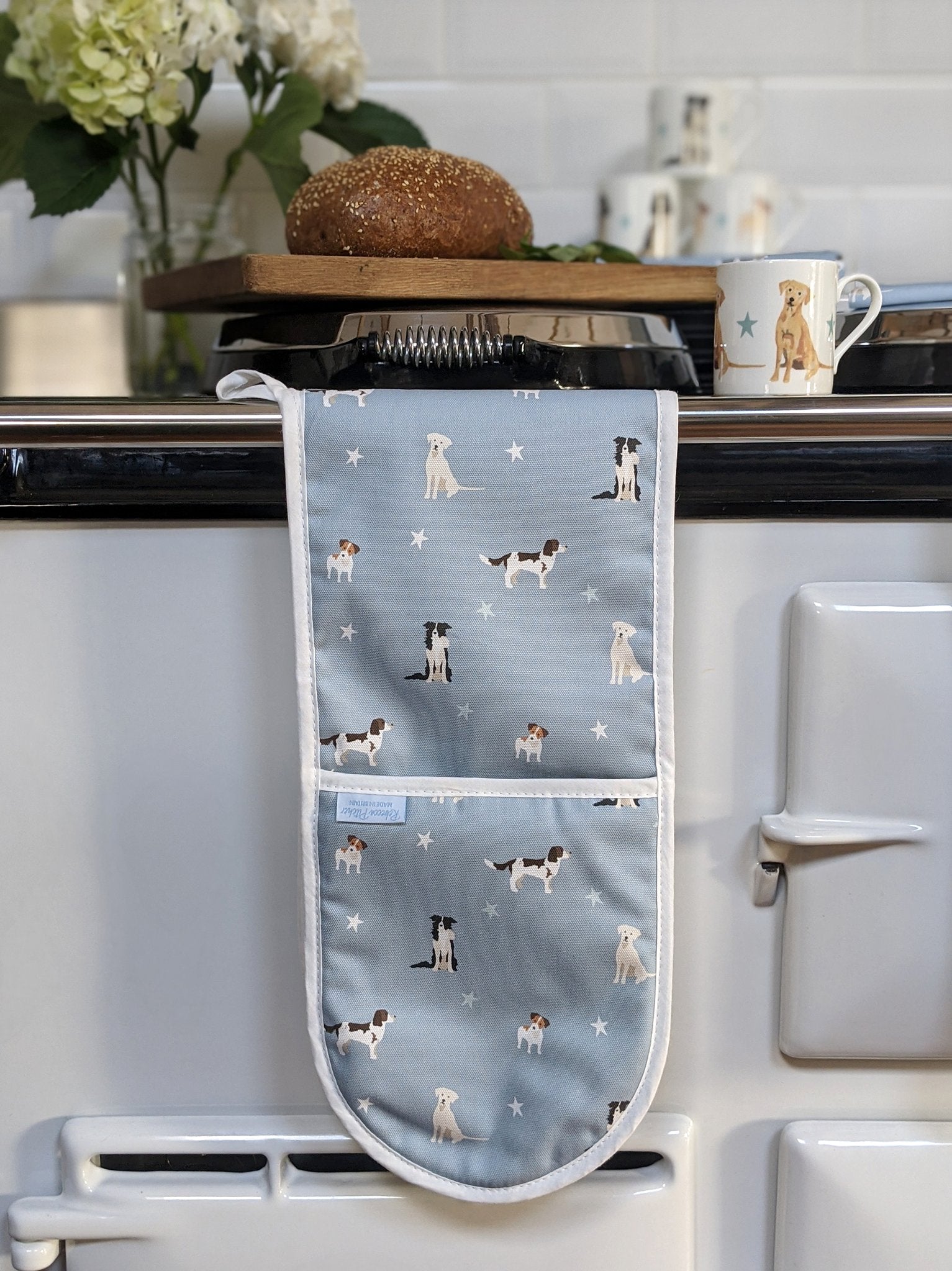 Rebecca Pitcher Double Oven Glove by Shabbyquins featuring playful dog designs in a vibrant color palette.