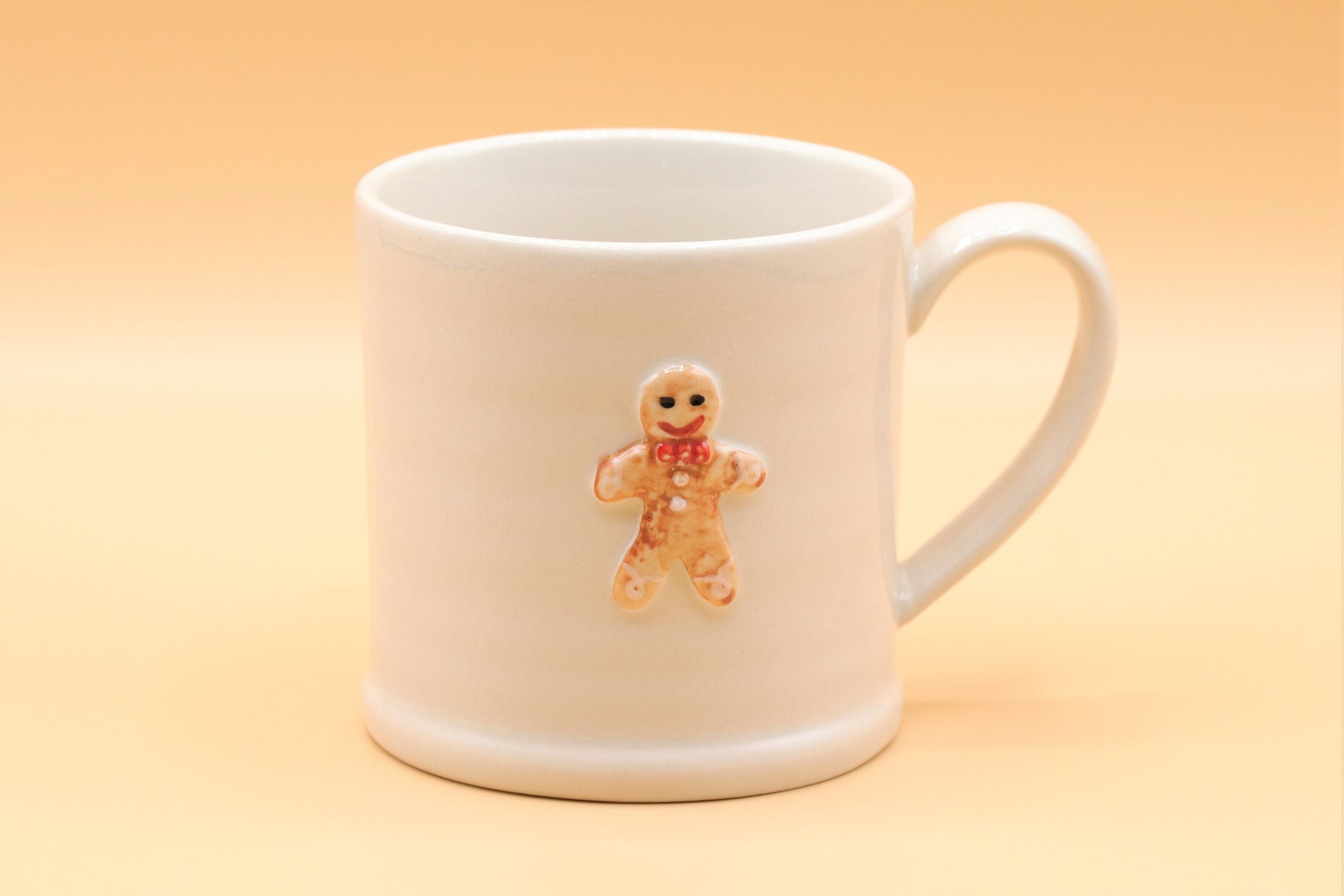 Sable Homeware ceramic mini Christmas mugs and jugs set with festive holiday designs and vibrant red and green colors.