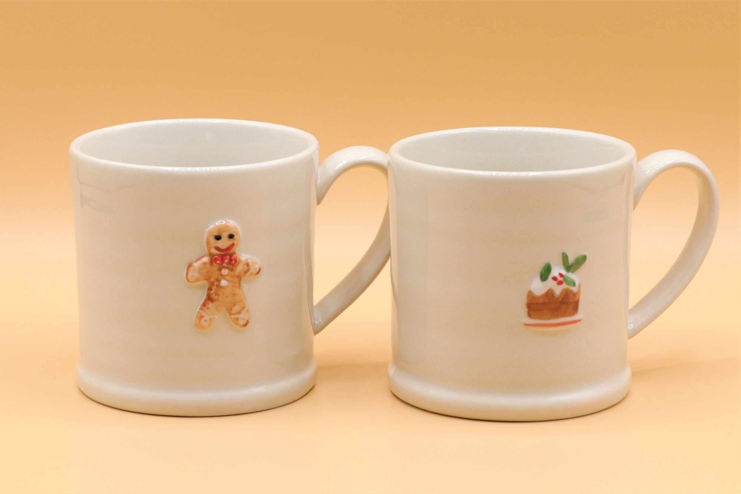 Set of ceramic mini Christmas mugs and jugs by Sable Homeware, featuring festive holiday designs on white ceramic.