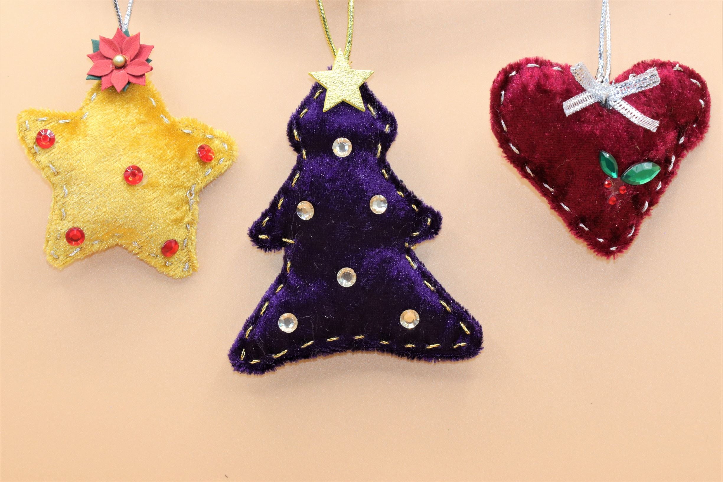 Handmade Christmas tree ornaments by Sable Homeware, featuring festive decorations with intricate designs and colorful details.