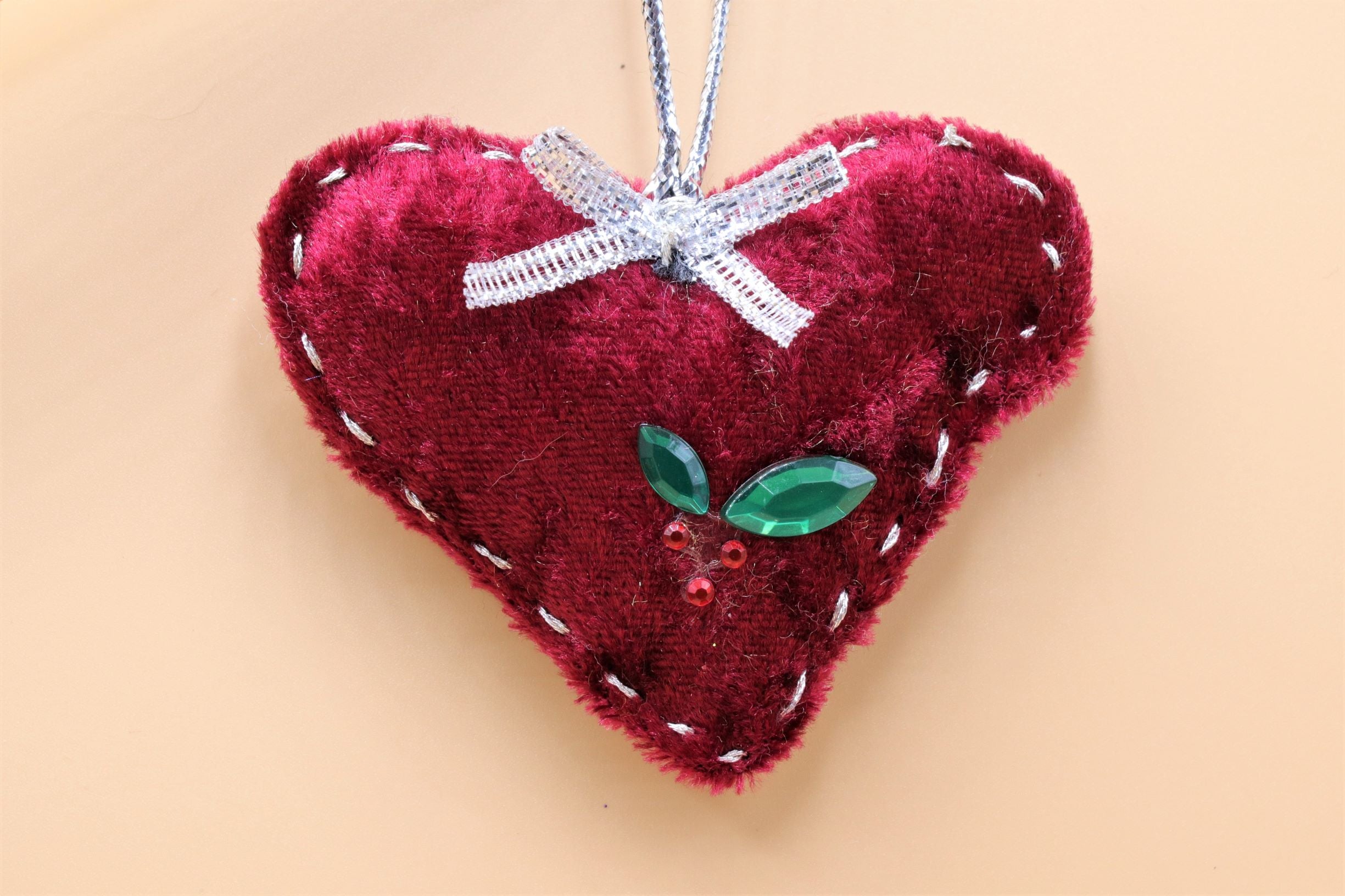 Handmade Christmas tree ornaments by Sable Homeware, featuring festive decorative ornaments hanging on a decorated tree.
