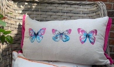 Rectangular cushion with hummingbird and butterfly designs by Sable Homeware, showcasing colorful nature-inspired artwork.