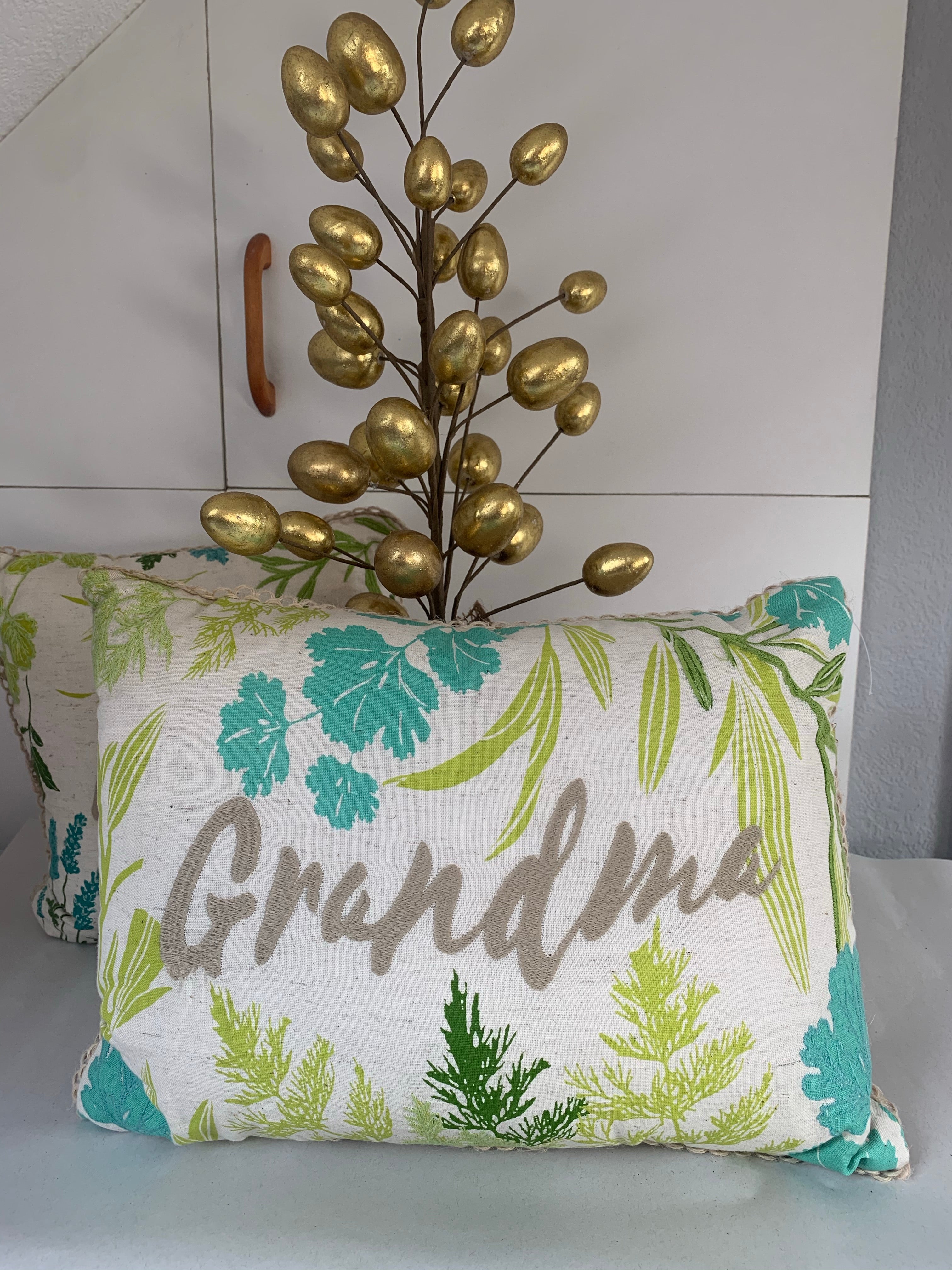 Green and blue floral cushions by Sable Homeware featuring Mum and Grandma designs, perfect for cozy living room decor.