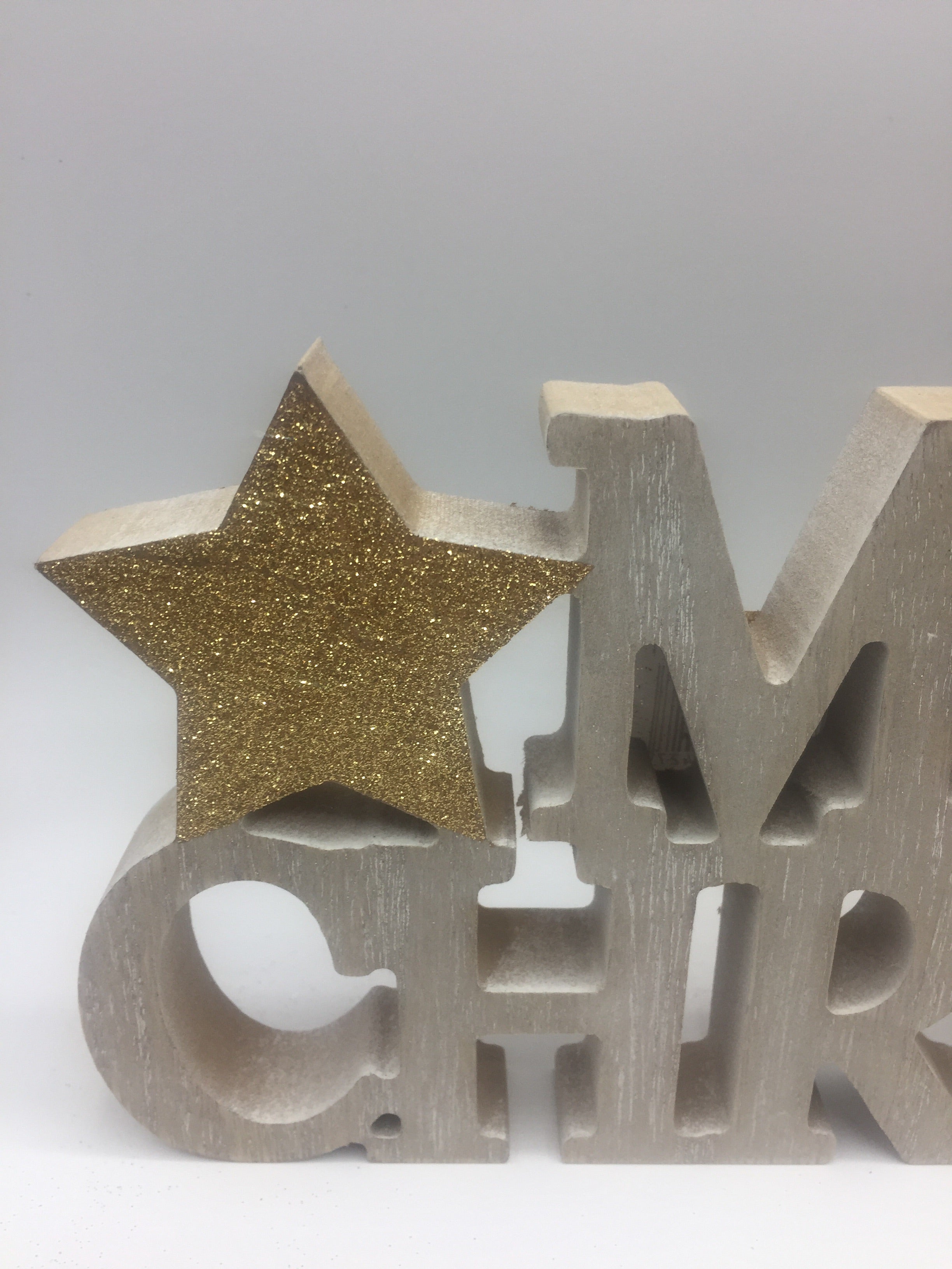 Sable Homeware Christmas wooden standing words decoration with "Merry Christmas" in festive script, two design options visible.