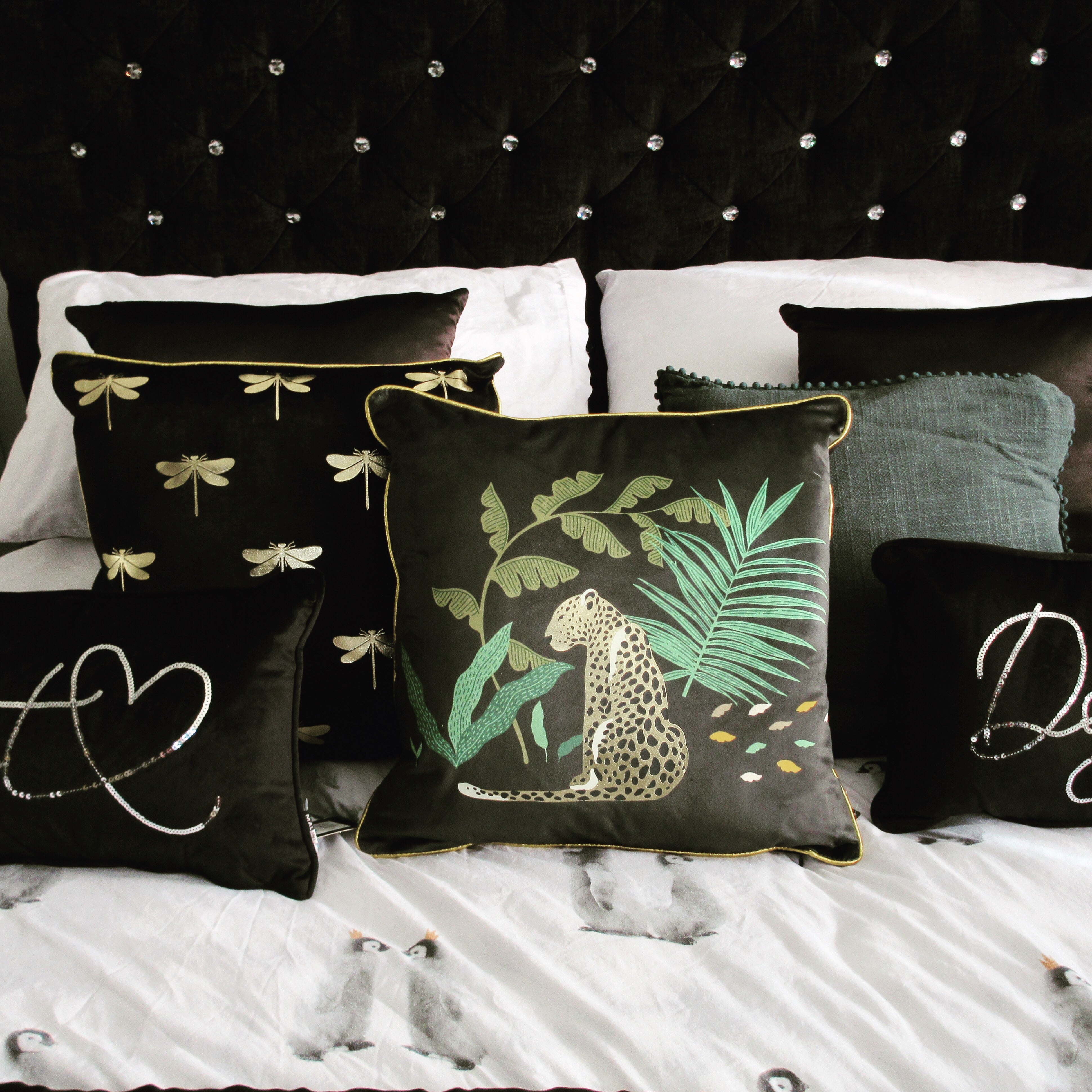 Black velvet sequin cushion featuring a cute cat or dog design from Sable Homeware, perfect for cozy home decor.