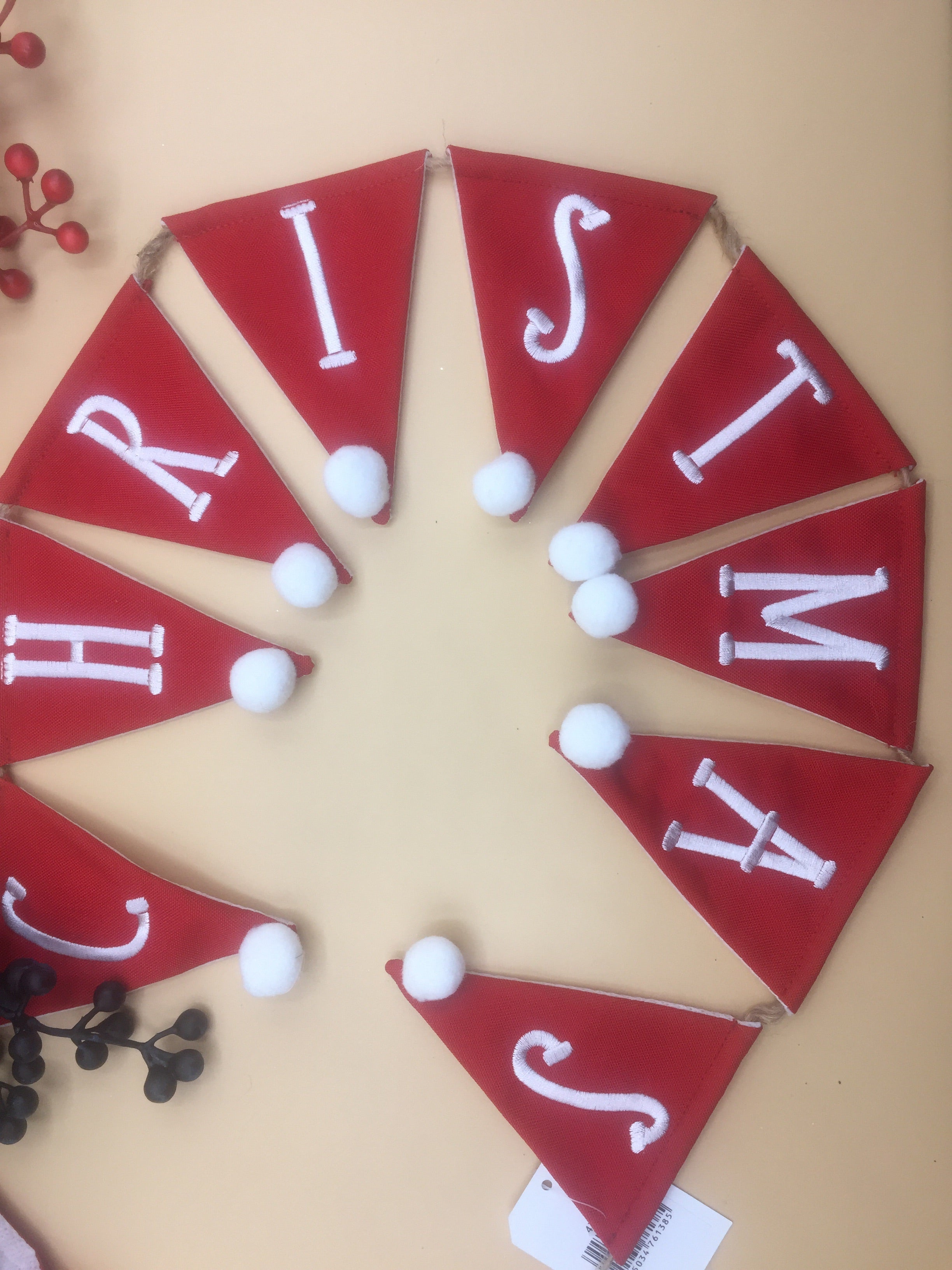 Red Merry Christmas bunting garland by Shabbyquins with festive fabric pennants hanging for holiday decoration.