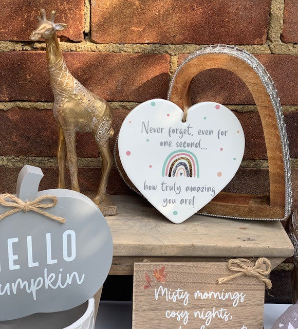 Colorful ceramic rainbow heart plaque by Shabbyquins, decorative ceramic sign with vibrant rainbow and heart design.